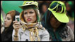 Woman using her mobile phone in a rally