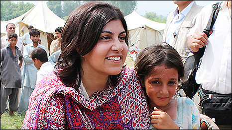 Baroness Warsi with a young flood survivor in Pir Sabak, Pakistan.  Credit: Vicki Francis / Kate Joseph / Department for International Development (DFID)