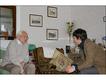 Visiting the home of a constituent and chatting in his sitting room. Photo: Margaret Langdon Hamilton