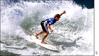 Surfer riding wave
