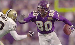 Minnesota's Cris Carter evades a tackle from Fred Thomas of New Orleans.