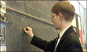 boy writing in French