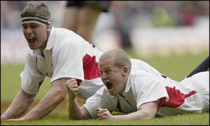 England fly-half Walder (right) celebrates his individual try