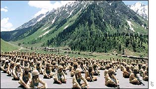 Troops sit on the ground near the working border