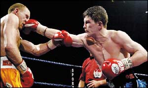 Ricky Hatton (right) fires out a right at Eamonn Magee on Saturday night 
