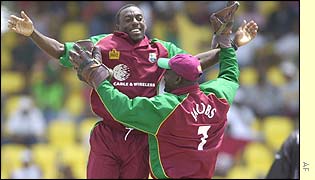 Pedro Collins and Ridley Jacobs celebrate Craig McMillan's wicket