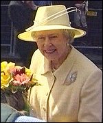 The Queen accepts a bouquet of flowers outside Bangor Cathedral