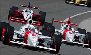 Team-mates De Ferran and Castroneves in action