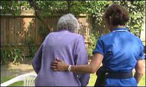 Nurse attends elderly woman