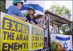 Israelis demonstrate at bus stop where bomb exploded