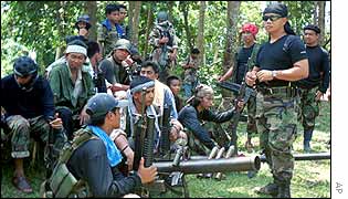 Abu Sayyaf spokesman Abu Sabaya, right foreground