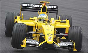 Giancarlo Fisichella's Jordan lifts a wheel at one of the new corners at the Nurburgring