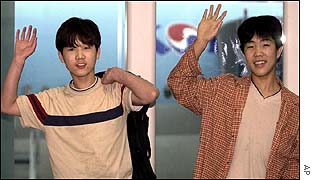 Kim Chul (right) and Kim Myong Chul at Seoul airport