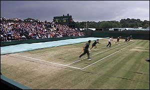 Ground staff were kept busy during a day of atrocious weather in SW19