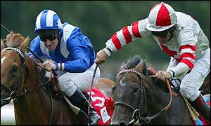 Millenary, ridden by Pat Eddery (r) edges out Mubtaker and Richard Hills