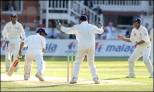 Virender Sehwag hit his third half-century in Tests before being bowled by Ashley Giles