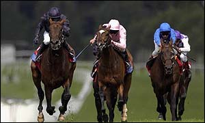 Hawk Wing (left) comes home first in the Coral Eclipse at Sandown