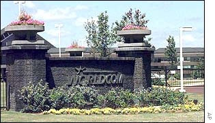Flowers decorate the building sign of the WorldCom corporate headquarters