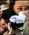 Two women mourning