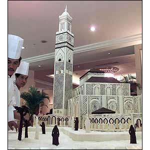 Indonesian chefs put the finishing touches to a 2.6 meter cake depicting the Hassan II mosque in Morocco  (AP)