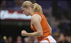 Kim Clijsters pumps her fist as she breaks the Williams serve