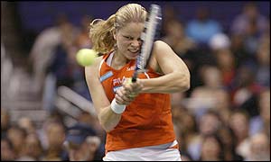 Clijsters powers a backhand return to Serena Williams