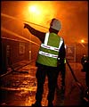 Army crews attend a fire