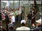 Photograph of loyalist prisoners leaving the Maze