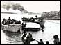 Servicemen escape the burning Sir Galahad on 8 June (PA)