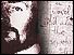 Graphic showing part of Peter Sutcliffe's face and part of one of his letters