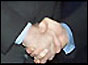 Werner Seifert and Don Cruickshank shake hands