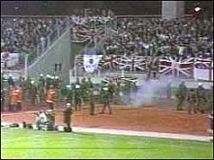 Police watch fans during the game