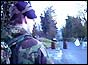 A soldier guards the roadblock set up at the scene of the murders