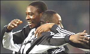 Newcastle's Shola Ameobi celebrates scoring his first goal with team-mate Lomano Lua Lua