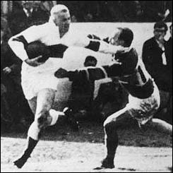 Tom Van Vollenhoven hands off one opponent as he begins his surge towards the Hunslet line 