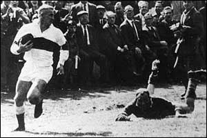 Another is left trailing as the St Helens winger hits top speed