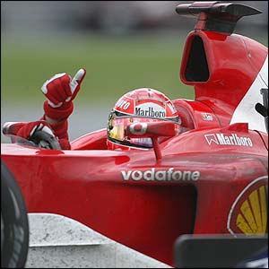 Michael Schumacher gives the thumbs up after a close win  