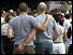 Two men with arms around each other