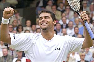 Mark Philippoussis  celebrates after his win  over Sebastien Grosjean
