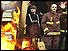 Firemen standing by brazier
