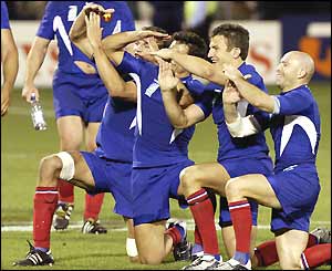 France celebrates beating the USA to finish top of Pool B