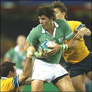 Ireland wing Shane Horgan tussles with Australian full-back Mat Rogers