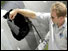 Nasa investigator examines hole after simulation test