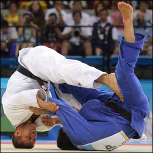 Georgi Georgiev (white) of Bulgaria fights against Oscar Penas (blue) of Spain in the men's judo 66 kg class bronze medal contest  