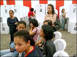 A group of Indonesia women wait for their turns to vote at Indonesia's Singapore  embassy