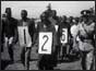 Mau Mau suspects with numbers round necks