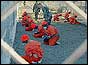 Prisoners kneeling in front of guards at Camp X-Ray