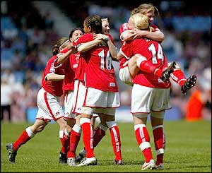 Charlton's players embrace after the referee blows the final whistle 
