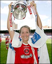 Charlton skipper Casey Stoney lifts the trophy