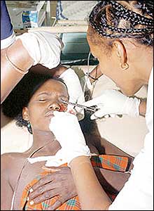 Woman having a bullet removed from her face. (Pic: The Standard)